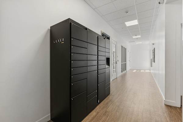 A long hallway with a black filing cabinet on the left. at 605 Place Student Housing & Co-Living, St George